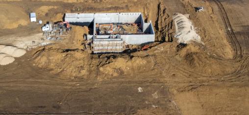 Image of the new westside library construction site where you see basement being dug