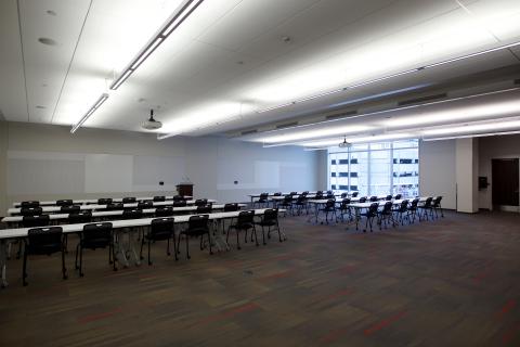 large meeting room set up with tables and chairs