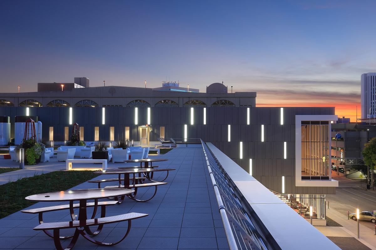 Rooftop with red picnic tables and space for 150 chairs